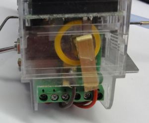 Smear epoxy on top of the positive strip and slip it into place as shown.