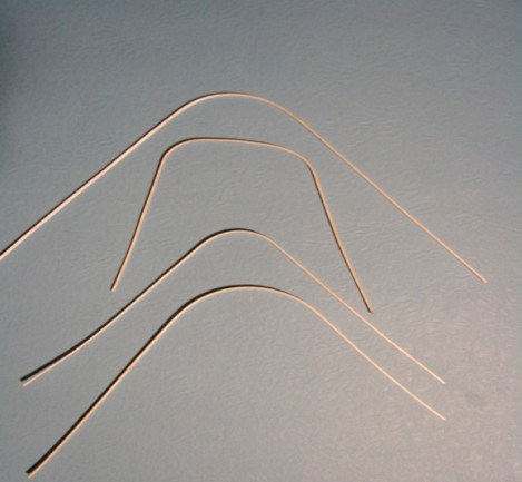 #3     The top three outlines are done on the ¾” Curling iron with the top one rolled to make a larger radius. The bottom one was made using the heat gun.