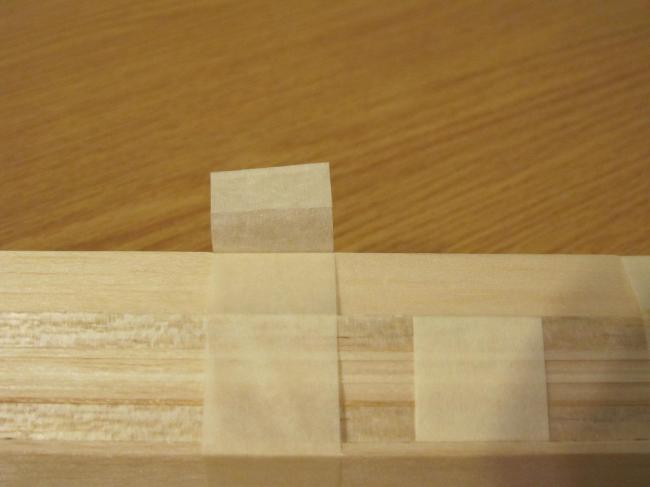 This detail impressed me - Tape folded over in a tab to easily remove the shipping balsa tapers. Every tape strip is like this. Nick Aikman's attention to detail is quite impressive. 